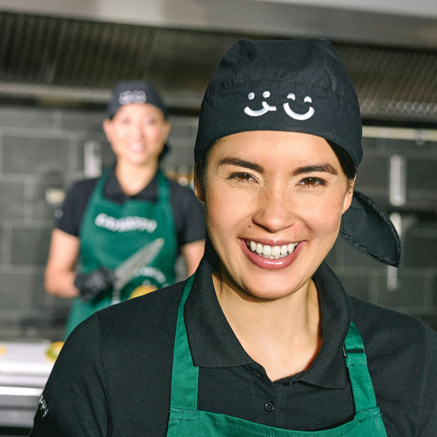 smiling EAT HAPPY employee